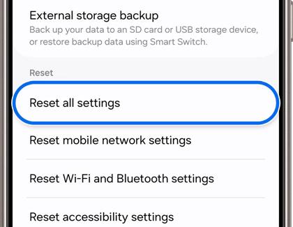 Samsung phone screen showing the “Reset all settings” option under the reset menu in the soft reset process.