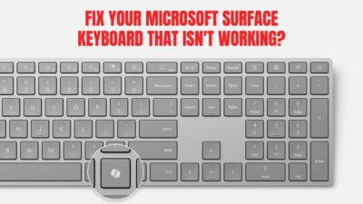 Grey Microsoft Surface keyboard with a highlighted key and bold red text reading “Fix Your Microsoft Surface Keyboard That Isn’t Working?”